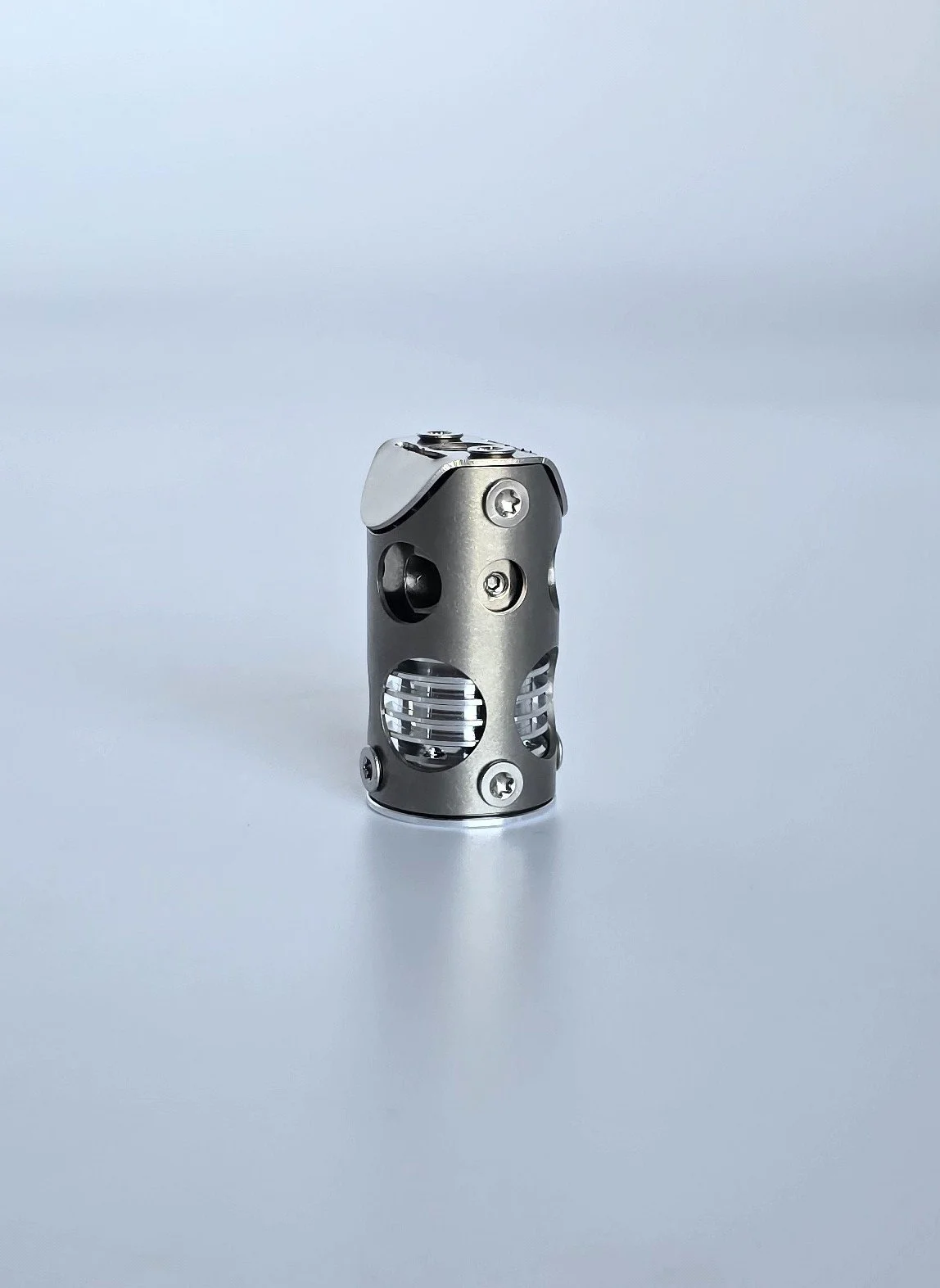 A close-up of Chube Compact standing upright on a white surface against a plain white background.